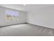Bedroom boasts ample natural light and neutral walls to provide a calming and inviting space at 22 Sagamore Avenue, Angier, NC 27501