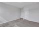 Bedroom features neutral walls, carpet, and a door to the closet and the en suite bathroom at 22 Sagamore Avenue, Angier, NC 27501