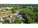 Aerial view of a home with mature trees, a large backyard, and neighborhood surroundings at 2240 Delaney Dr, Burlington, NC 27215