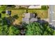 Aerial view of a home with a well-manicured lawn and mature trees at 2240 Delaney Dr, Burlington, NC 27215