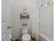 Bright bathroom featuring a bathtub, shower, toilet, and neutral walls and floors at 2240 Delaney Dr, Burlington, NC 27215