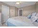 Bright primary bedroom featuring a large window, ceiling fan, and neutral colors at 2240 Delaney Dr, Burlington, NC 27215