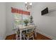 Cozy dining area with a chandelier and a view through the window at 2240 Delaney Dr, Burlington, NC 27215