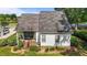 Aerial view of a home with a covered porch and stone paver path leading to the backyard at 2240 Delaney Dr, Burlington, NC 27215