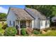 Charming home with a covered back porch, manicured lawn and landscaped garden at 2240 Delaney Dr, Burlington, NC 27215