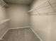 Walk-in closet with carpet and wire shelving ready for storage solutions at 235 Starry Sky Dr, Benson, NC 27504