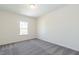 Carpeted bedroom featuring neutral walls and natural lighting at 241 E Victory View Ter, Smithfield, NC 27577