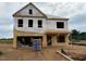 Exterior shot of a home under construction with visible framing and plywood at 241 E Victory View Ter, Smithfield, NC 27577