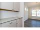 Close up of a kitchen with granite countertops, white cabinets and stainless steel appliances at 241 E Victory View Ter, Smithfield, NC 27577