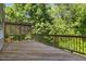 A wooden back deck with a forest view at 2523 Ferdinand Dr, Knightdale, NC 27545