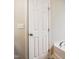 Close-up of bathroom door in a bright setting next to a new bath tub at 2523 Ferdinand Dr, Knightdale, NC 27545