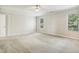 Spacious bedroom with carpet, two windows, and natural light at 2523 Ferdinand Dr, Knightdale, NC 27545
