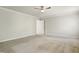 Neutral bedroom with ceiling fan and a white door leading to another room at 2523 Ferdinand Dr, Knightdale, NC 27545