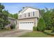 Charming two-story home with a two-car garage and beautifully landscaped front yard at 2523 Ferdinand Dr, Knightdale, NC 27545