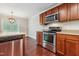 Bright kitchen features stainless steel appliances and hardwood floors at 2523 Ferdinand Dr, Knightdale, NC 27545