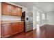 Modern kitchen with stainless steel refrigerator and dark cabinets at 2523 Ferdinand Dr, Knightdale, NC 27545