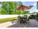 Charming backyard with a patio, outdoor furniture, and a well-maintained lawn at 2531 Impulsion Dr, New Hill, NC 27562