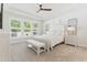 Serene main bedroom with tray ceiling, plush carpet, and large windows with shutter blinds at 2531 Impulsion Dr, New Hill, NC 27562