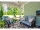 Inviting screened porch with comfortable seating, a ceiling fan, and a view of the backyard at 2531 Impulsion Dr, New Hill, NC 27562