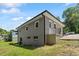 Exterior side view of home on a sunny day with a grass yard at 2540 Atlantic St, Durham, NC 27707