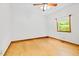 Bright bedroom featuring hardwood floors and a window with natural light at 2600 Snow Hill Rd, Durham, NC 27712
