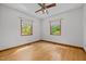 Spacious bedroom with hardwood floors, ceiling fan, and natural light at 2600 Snow Hill Rd, Durham, NC 27712