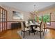 Elegant dining room featuring a chandelier and floral wallpaper at 2600 Snow Hill Rd, Durham, NC 27712