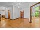 Spacious foyer with hardwood floors and natural lighting, leading to various areas of the home at 2600 Snow Hill Rd, Durham, NC 27712