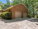 Exterior view of the two car garage with brick facade at 2600 Snow Hill Rd, Durham, NC 27712
