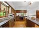 Kitchen featuring an island, hard wood floors and ample counter space at 2600 Snow Hill Rd, Durham, NC 27712