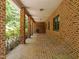 View down the long brick porch at 2600 Snow Hill Rd, Durham, NC 27712