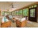 Inviting screened porch with wicker furniture and outdoor views at 2600 Snow Hill Rd, Durham, NC 27712