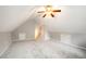 Large bonus room features neutral carpet and walls, as well as a ceiling fan at 2735 Clifton Ave, Creedmoor, NC 27522