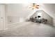 Spacious carpeted bonus room featuring a ceiling fan with a light and neutral walls at 2735 Clifton Ave, Creedmoor, NC 27522