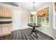 Breakfast nook with bay window, hanging light fixture, and hardwood floors at 2735 Clifton Ave, Creedmoor, NC 27522