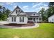 Charming single Gathering home with white siding, a covered porch, and well maintained front yard at 2735 Clifton Ave, Creedmoor, NC 27522