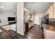 View of kitchen with stainless steel appliances and dark hardwood floors in a living space at 2735 Clifton Ave, Creedmoor, NC 27522