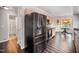 Modern kitchen features stainless steel appliances, breakfast nook, and hardwood floors at 2735 Clifton Ave, Creedmoor, NC 27522