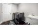 Clean laundry room features modern appliances, utility sink, and durable flooring at 2735 Clifton Ave, Creedmoor, NC 27522