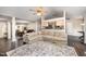 Open-concept living area with hardwood floors, flowing into the kitchen and dining space at 2735 Clifton Ave, Creedmoor, NC 27522
