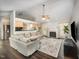Spacious living room featuring a fireplace, dark hardwood floors, and an open layout to the kitchen at 2735 Clifton Ave, Creedmoor, NC 27522