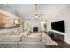 Cozy living room with vaulted ceilings, fireplace, dark floors, and an open floor plan at 2735 Clifton Ave, Creedmoor, NC 27522