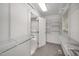Walk-in closet features wire rack shelving and adjoins bathroom at 2735 Clifton Ave, Creedmoor, NC 27522