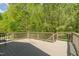 This deck overlooks a green backyard at 3010 Blueberry Ln, Chapel Hill, NC 27516