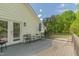 This back deck includes patio furniture and a nice view at 3010 Blueberry Ln, Chapel Hill, NC 27516