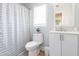 Well-lit bathroom featuring a shower with stylish curtain and modern vanity at 3010 Blueberry Ln, Chapel Hill, NC 27516