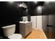 This powder room boasts a modern vanity and updated fixtures at 3010 Blueberry Ln, Chapel Hill, NC 27516