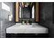 Sleek bathroom vanity with white marble countertop, gold faucet, and modern mirror at 3010 Blueberry Ln, Chapel Hill, NC 27516