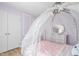 Light-filled bedroom with a unique canopy bed and white accents at 3010 Blueberry Ln, Chapel Hill, NC 27516