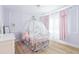 Charming bedroom with hardwood floors, decorative walls, and playful pink accents at 3010 Blueberry Ln, Chapel Hill, NC 27516